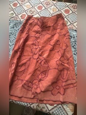 100% Leather Vintage Midi Skirt with embroidered floral design in a darker orang